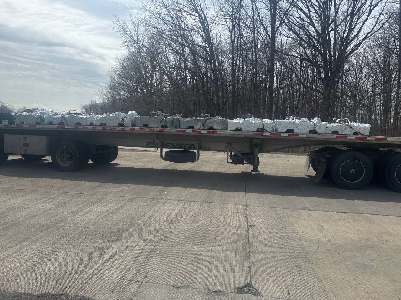Flatbed truck carrying specialized industrial freight